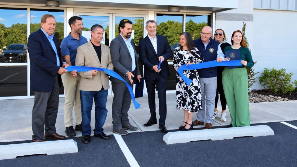Davinci Micro Fulfillment CEO Corey Apirian cuts the ribbon with community leaders outside the new Jenkins Township, PA facility